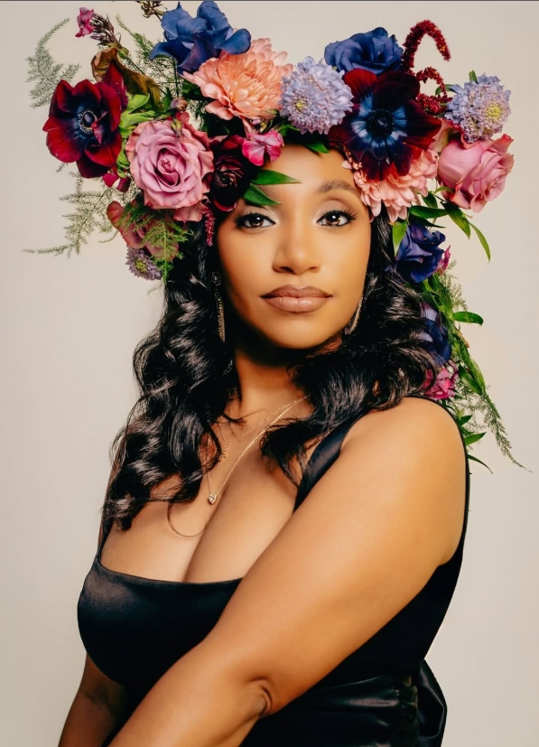 Portrait with a dramatic multicolored floral crown