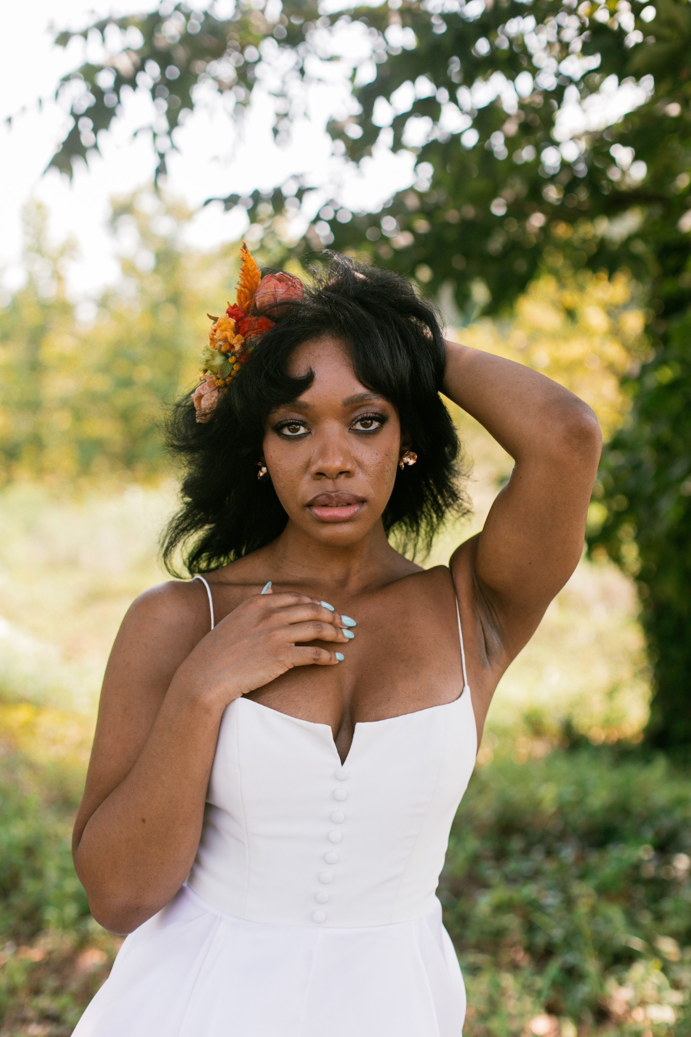 Outdoor portrait in a white dress and floral crown