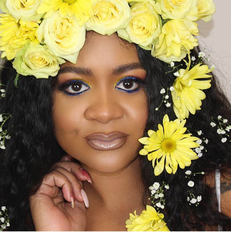 Portrait framed by bright yellow flowers