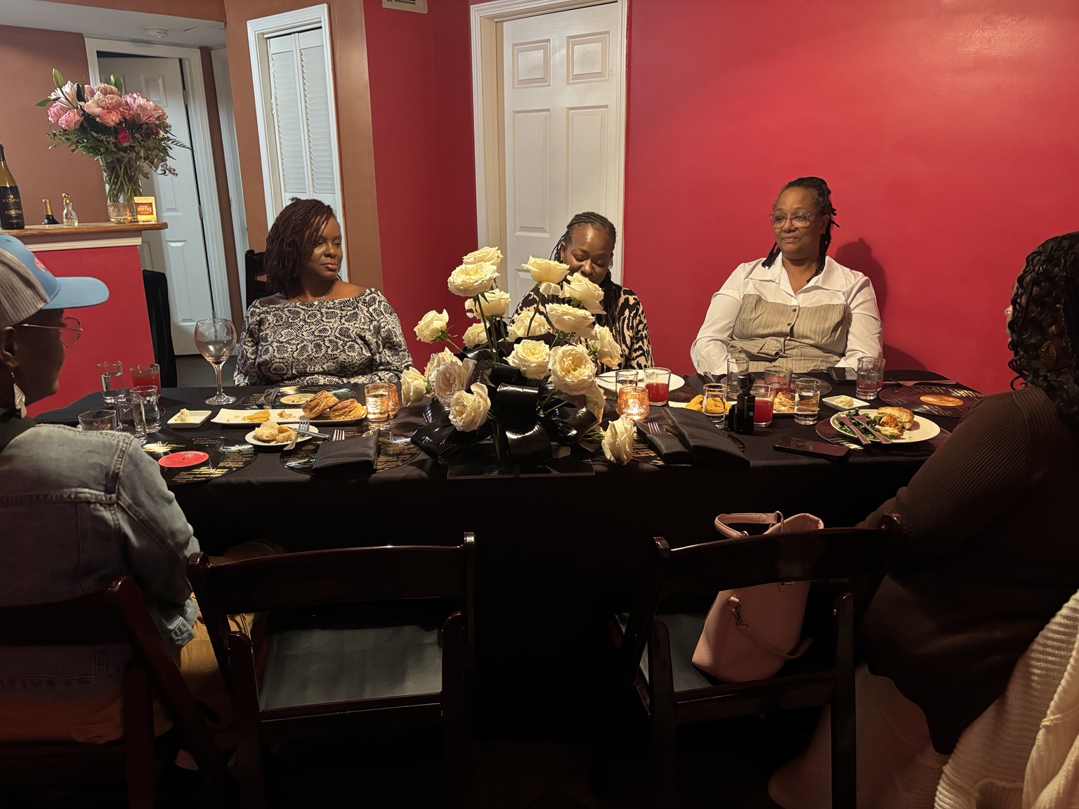 Guests gathered around the table at DUO: An Evening of Two