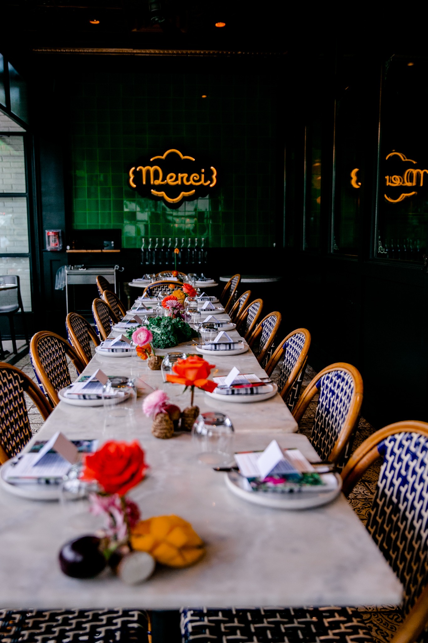 A warmly set dining table representing The Table