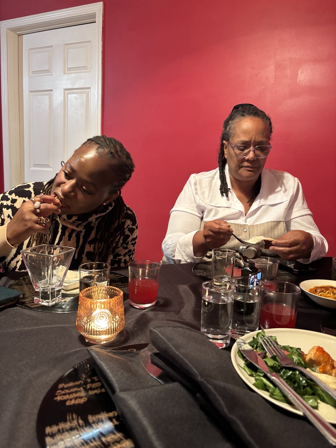 Two guests enjoying a meal at Sunday Supper